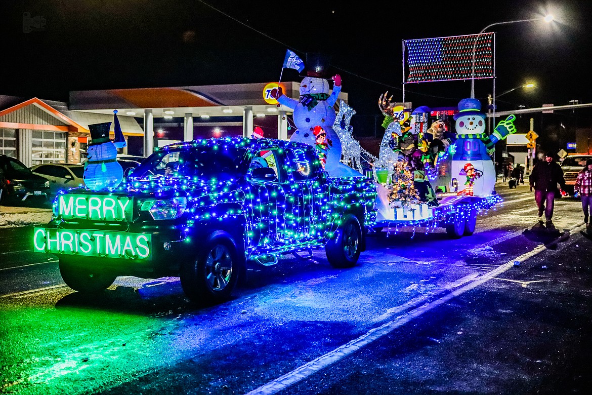 A truck decked out in Christmas lights transports a float during the 2022 Christmas Miracle on Main Street Othello parade in front of Othello City Hall. This year’s parade will begin at 5 p.m. Dec. 2, also in front of City Hall.