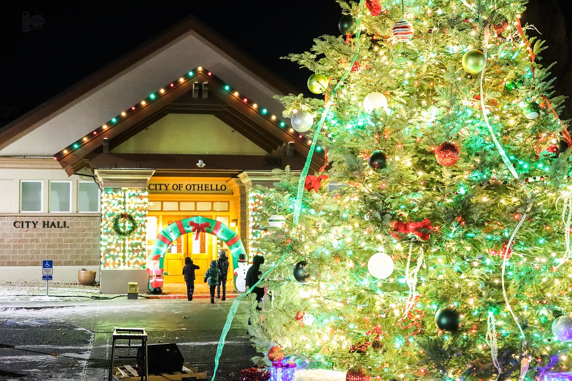 A group of kids walks into Othello City Hall during the 2022 Christmas Miracle on Main Street celebration. The City of Othello helps fund the event and fully pays for the annual fireworks display.