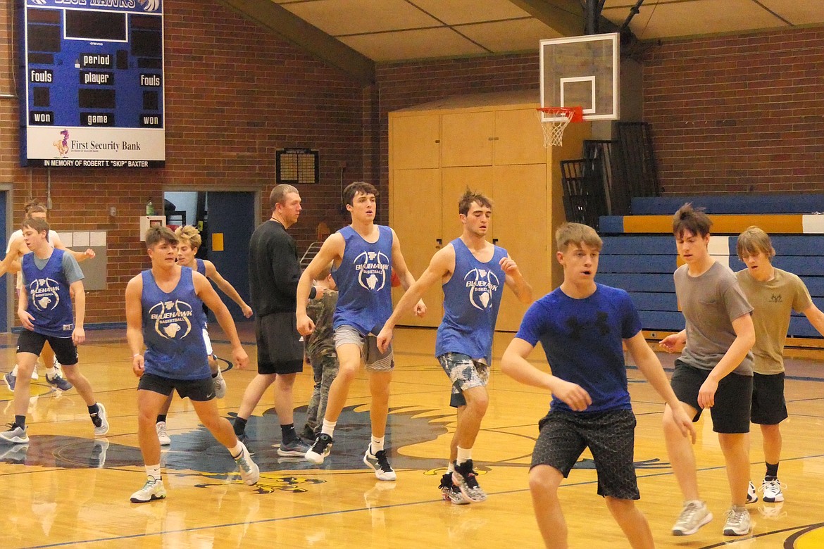 Thompson Falls basketball coach Jake Mickelson (Black shirt and shorts) conducts pre-season drills with this year's Blue Hawks basketball team as they prepare for the 2023-24 season last week in T Falls.  (Chuck Bandel/VP-MI)