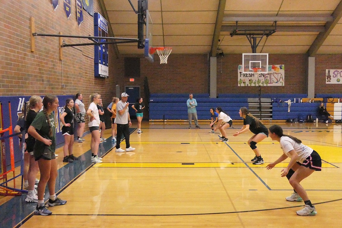 Thompson Falls girls head basketball coach Mike Tessier, with whistle, conduct drills with this year's Lady Hawks team as they prepare for the 2023-24 season set to open next month. (Chuck Bandel/VP-MI)