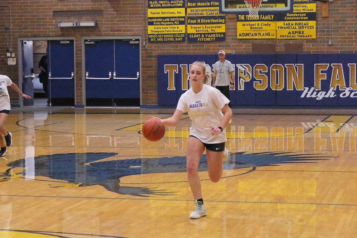 Sophomore Gabi Hannum runs during dribbling drills at a recent Thompson Falls Lady Hawks basketball practice in preparation for the team's season opening next month.  (Chuck Bandel/VP-MI)