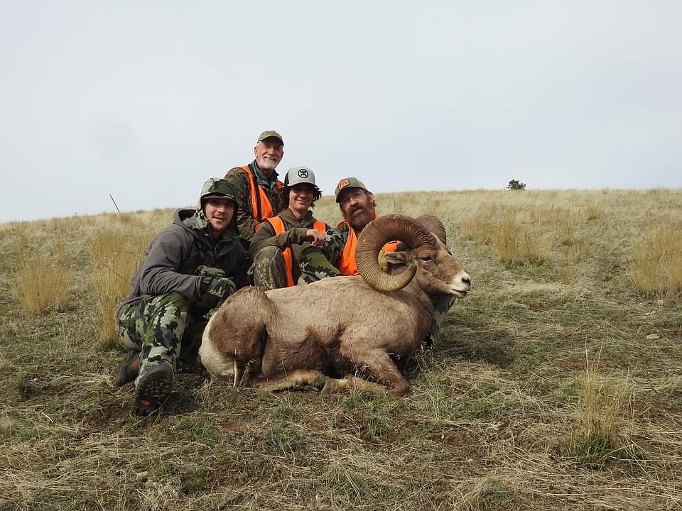 Members of the hunting group that was part of bagging a trophy size Bighorn Sheep ram last week in the Bitterroot Mountains are, from left to right:  Will Tatum, Kelly Palmer, Greg Tatum and Plains English teacher and head football coach Mike Tatum (far right).  Will and Greg are Mike's sons, while Palmer is a longtime friend.  (Photo courtesy of the Tatum family)