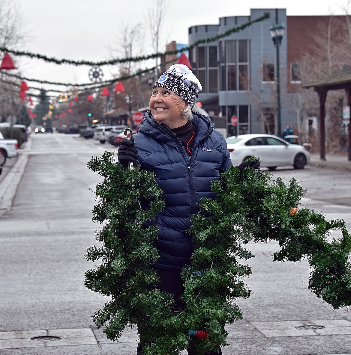 Flathead Electric Cooperative and several residents volunteered to put up Whitefish's winter decorations on Sunday. (Julie Engler/Whitefish Pilot)