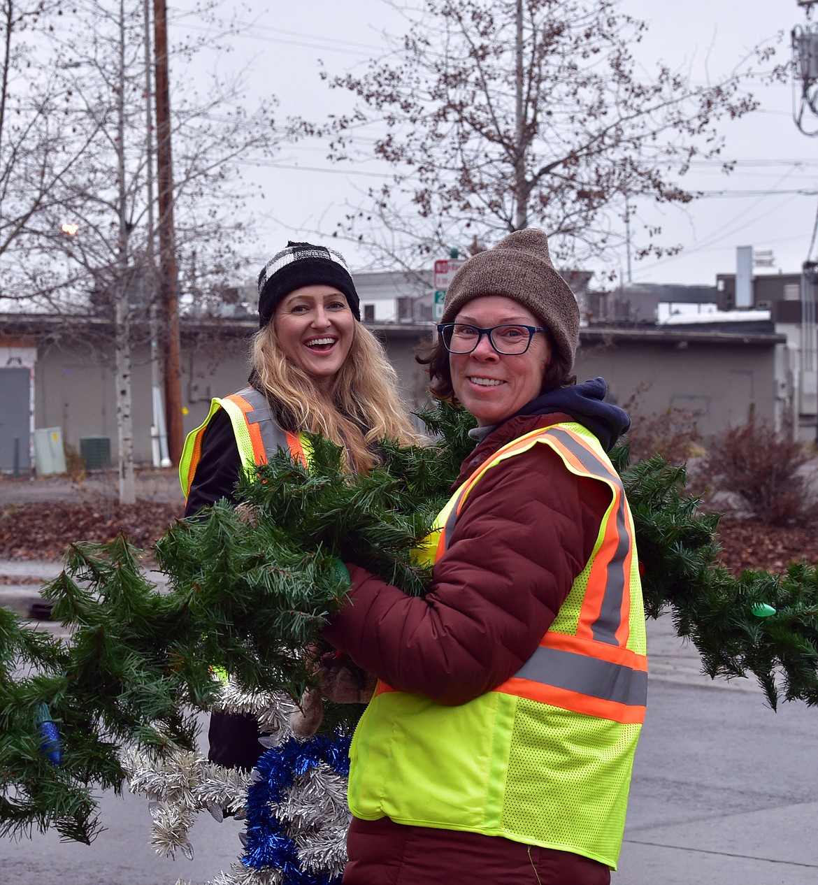 Flathead Electric Cooperative along with several residents volunteered to put up Whitefish's winter decorations on Sunday. (Julie Engler/Whitefish Pilot)