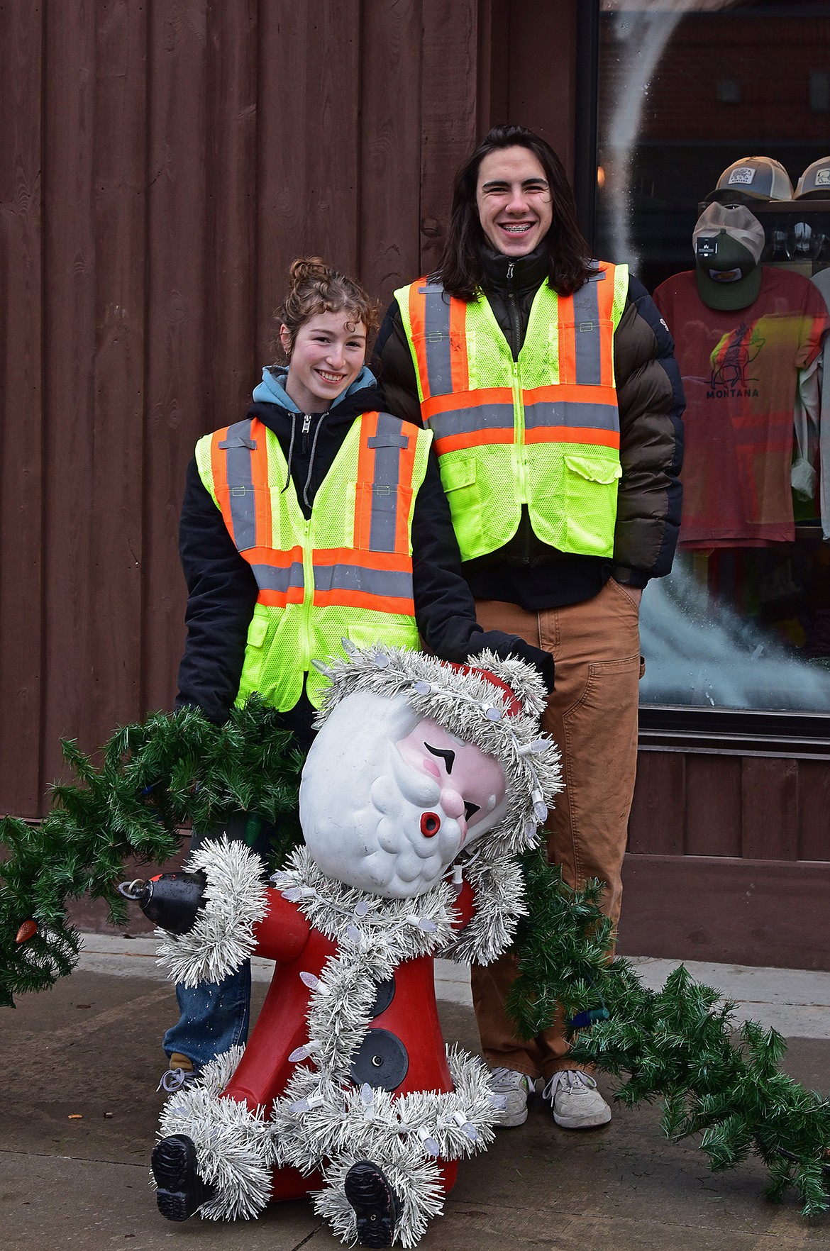 Flathead Electric Cooperative and several residents volunteered to put up Whitefish's winter decorations on Sunday. (Julie Engler/Whitefish Pilot)