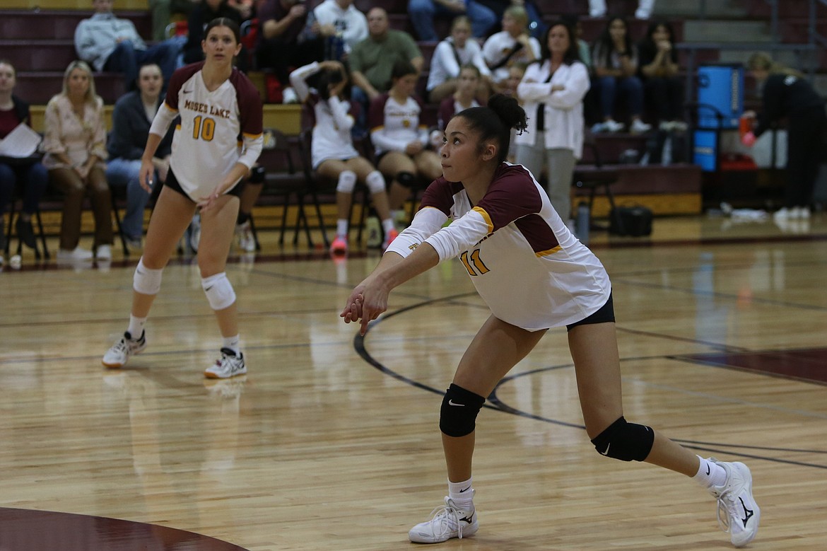 Moses Lake junior Madison Bond (11) looks to perform a dig against Davis on Sept. 26.