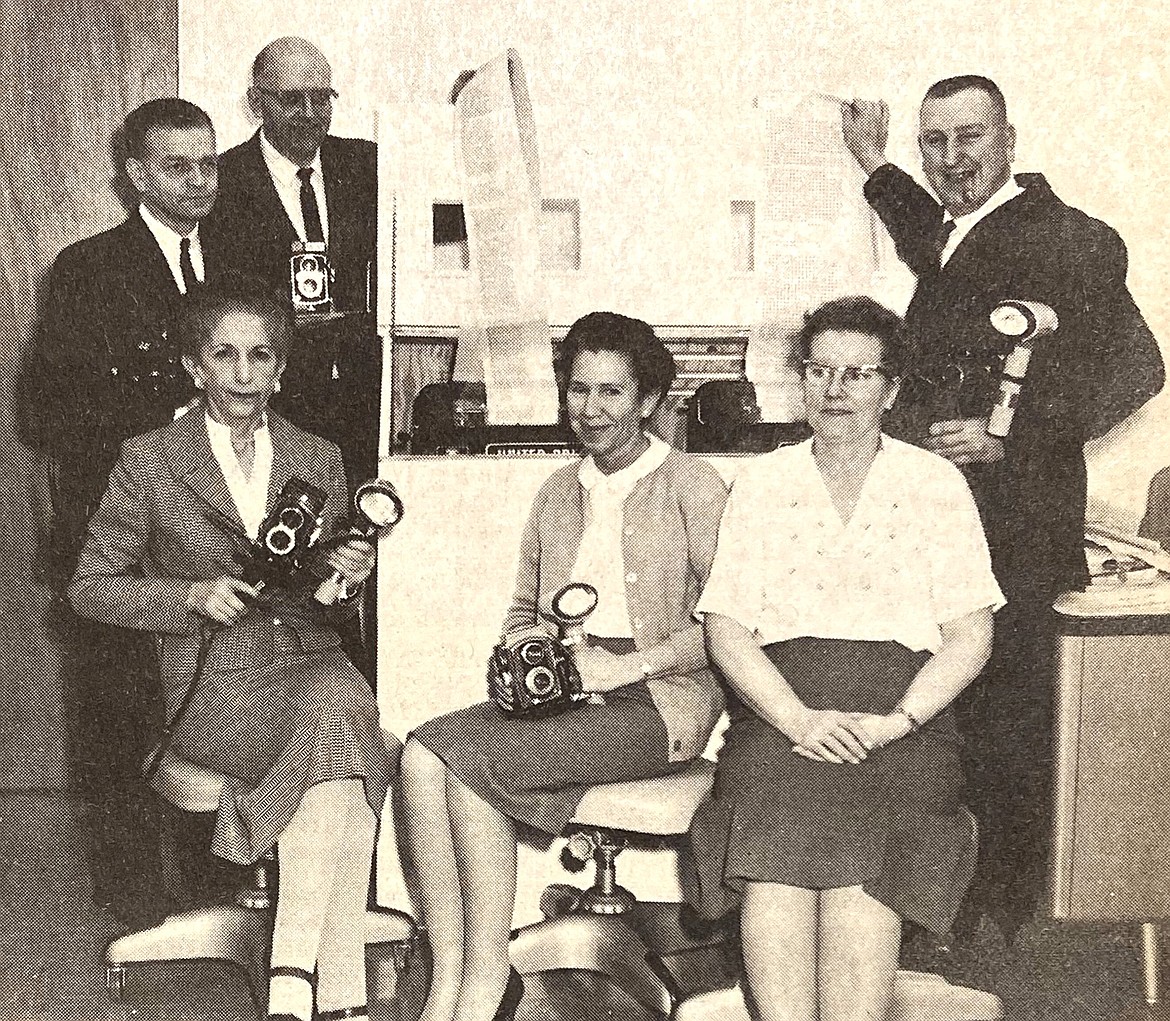 The Coeur d’Alene Press staff in November 1963: (seated from left) Frances Cope, government and police reporter; Kay Dimeling, women’s news; and Mabel Gellner, dark-room technician; and (standing from left) Charles Sowder, city editor; Harry Arnold, general news editor; and Bob Maker, sports editor.