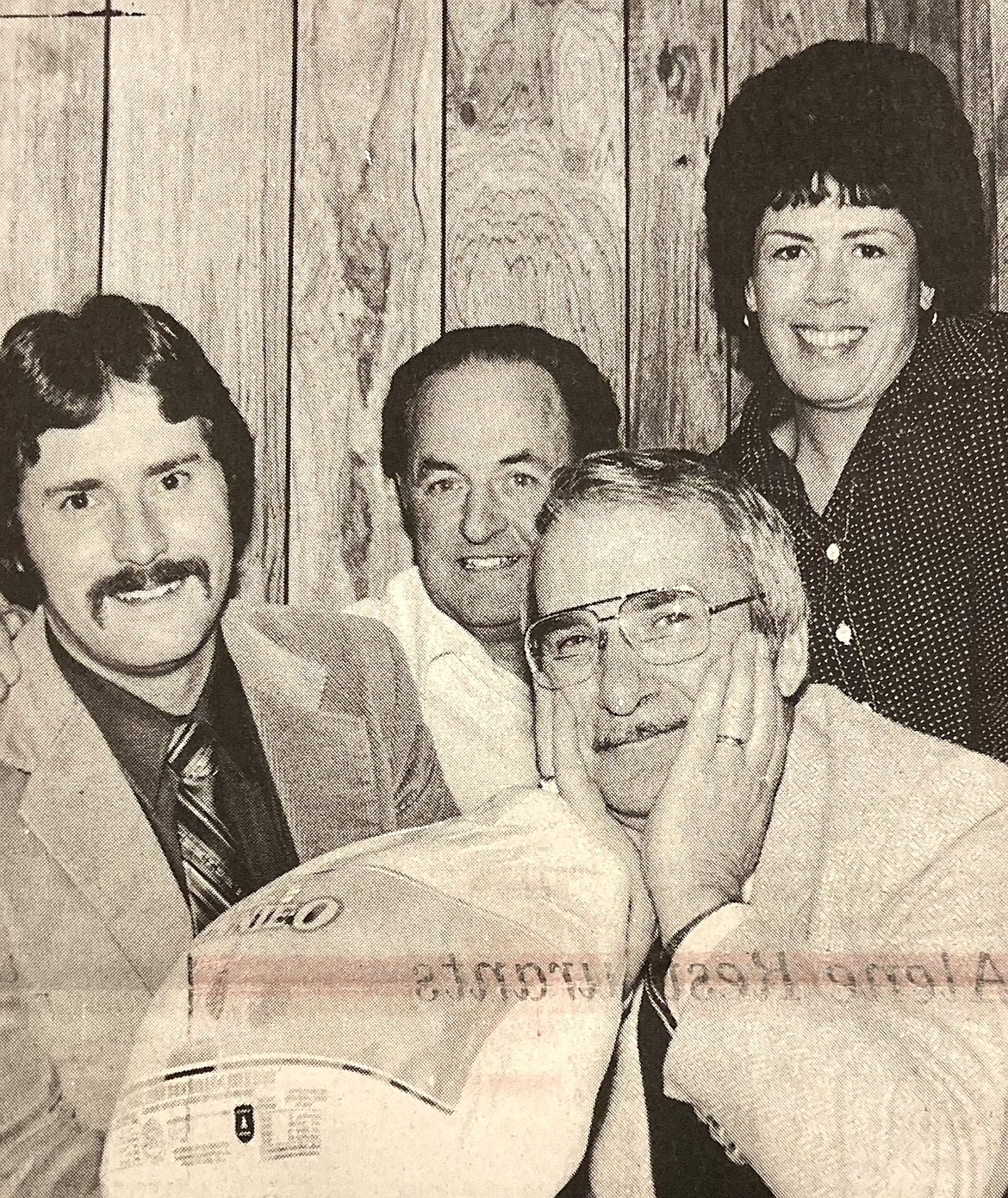 Assessor Tom Moore, bottom, gets a bird from employees (from left) Mike McDowell, Fred Petragallo, and Kathleen Henry.