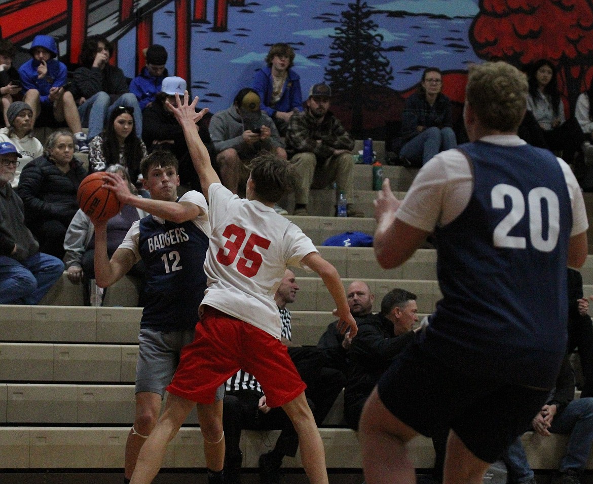 Bonners Ferry's Asher Williams looks to pass inside to teammate Trey Bateman.