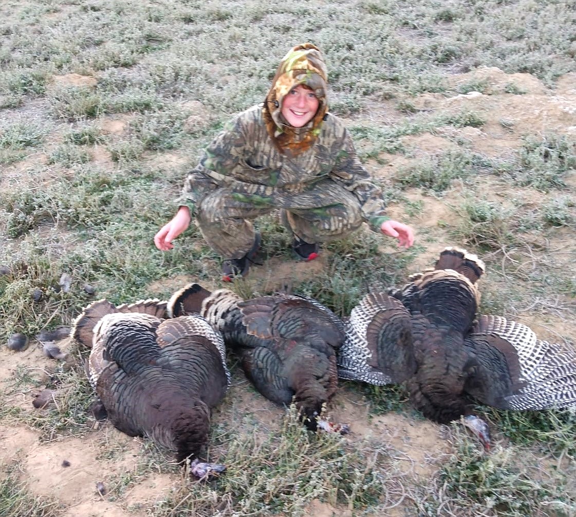 Gordon harvests three turkeys.