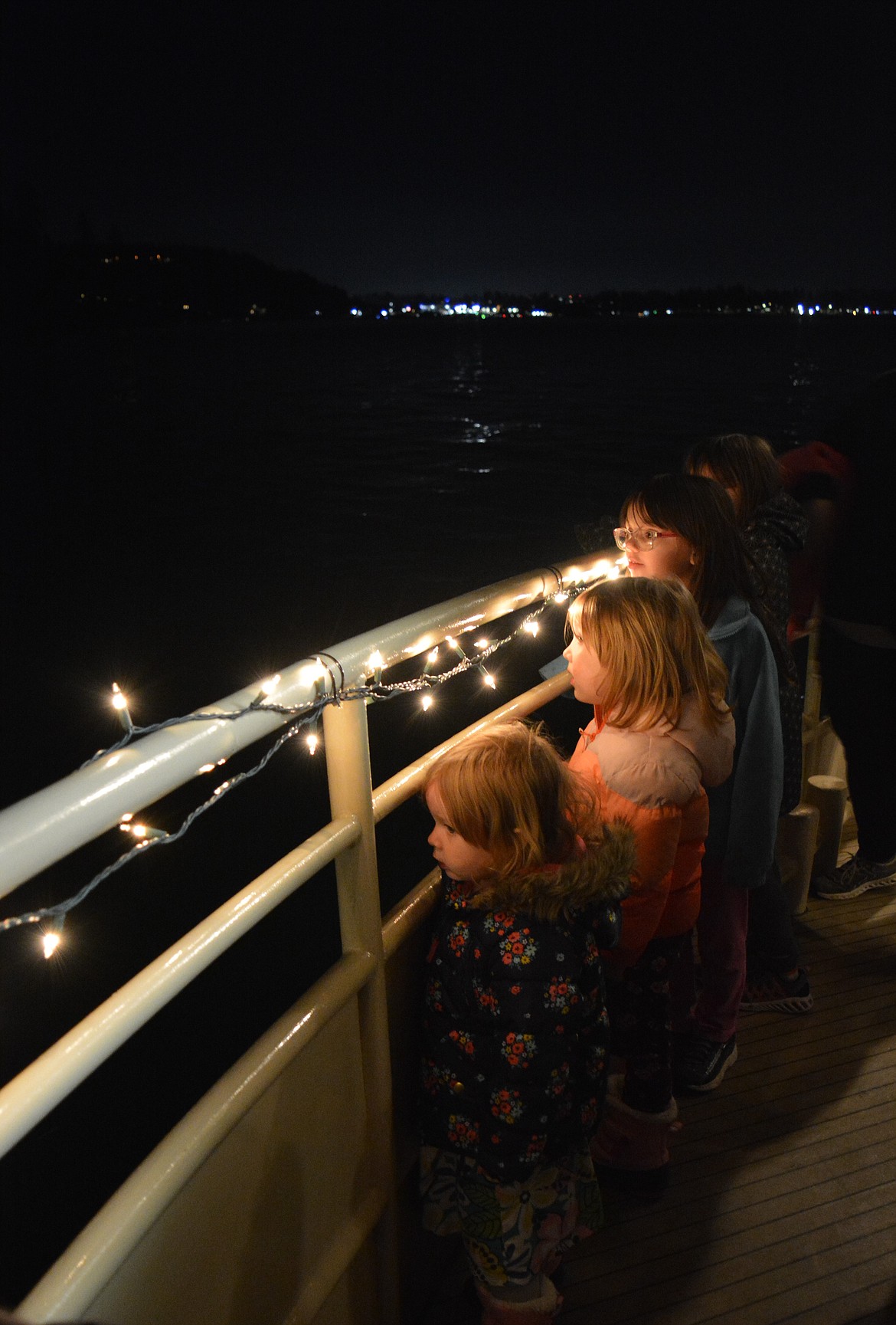 Five-year-old Runa Hubbard watches a light show at the North Pole with her family.