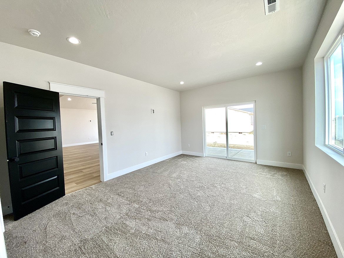 The attached master bedroom in a house in Othello that would make it easier to implement multigenerational housing since it has all the features of a traditional master bedroom.