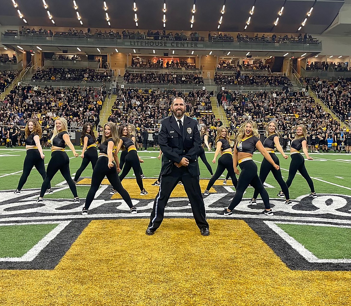 Sandpoint High School school resource officer Don Little is pictured with members of the University of Idaho's Gem Dance Team at halftime of the recent Idaho-Idaho State game. Little performed alongside his daughter, Mikah Little and SHS alumni Haleigh Knowles.