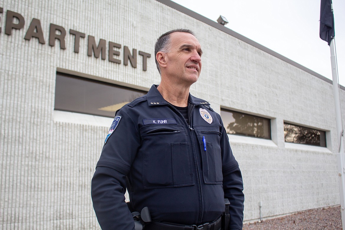 Moses Lake Police Chief Kevin Fuhr looks out towards cars passing by outside the police station in Moses Lake on a Tuesday afternoon in 2021. Fuhr helped start the ball rolling toward a new police station as chief and will help finalize plans as city manager.