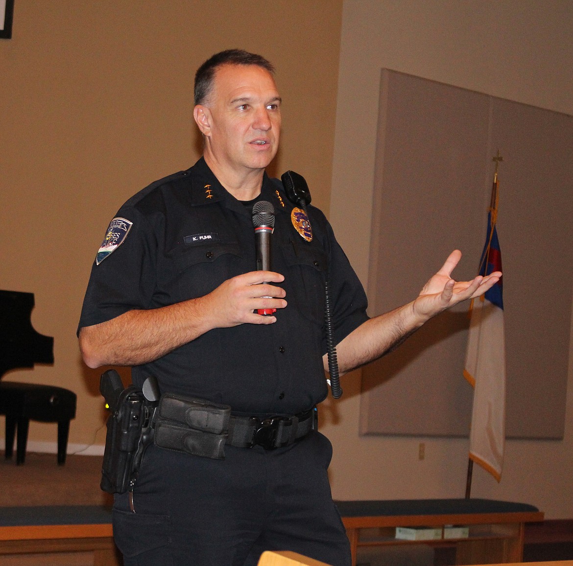 Moses Lake Police Chief Kevin Fuhr answered questions from residents at a town hall meeting on a Sunday in 2018. Fuhr has said that community engagement events like this help to build relationships with members of the community.