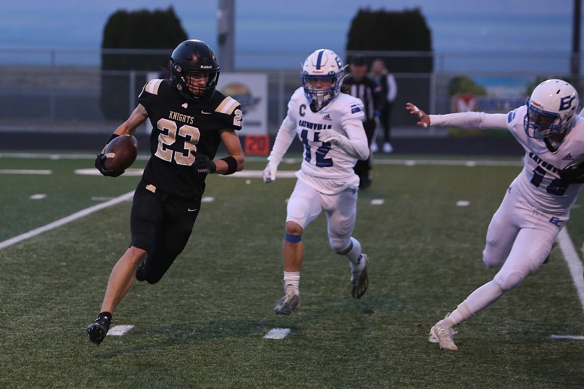 Royal sophomore Shea Stevenson (23) carries the football against Eatonville on Nov. 10.