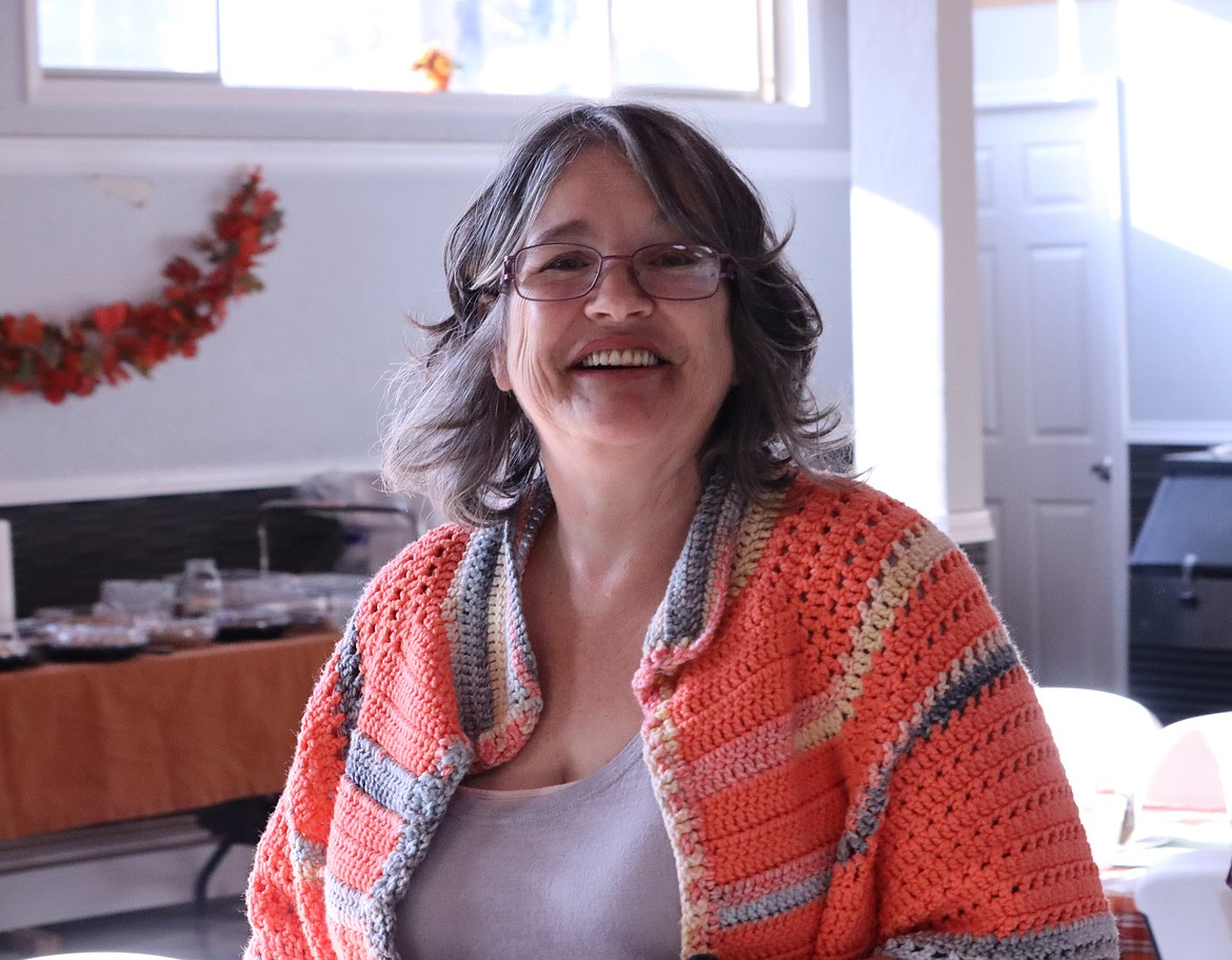 Stephanie Roberts smiles during a break from working on the Thanksgiving meal on Thursday at The Altar Church.