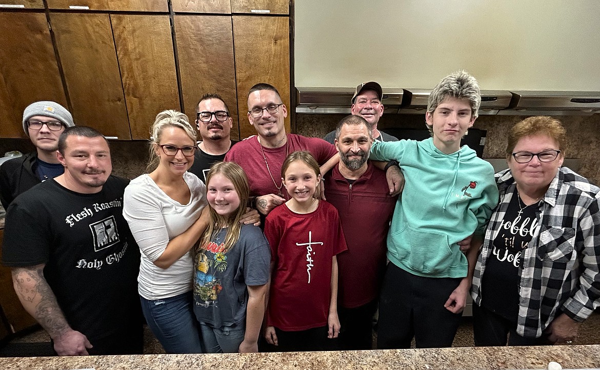 Volunteers arrived early Thursday at The Altar Church to work on a free Thanksgiving meal for the community.Front row, from left, Dillon Hooker, Daelyn Gardiner, Bella Padula, Arianna Padula, Jason Dynes, Henry Ahrnsbrak and Darlene Fox. Back row Joshua Yax, 
Conley Murillo, Daniel Aga and Gene Keigh.