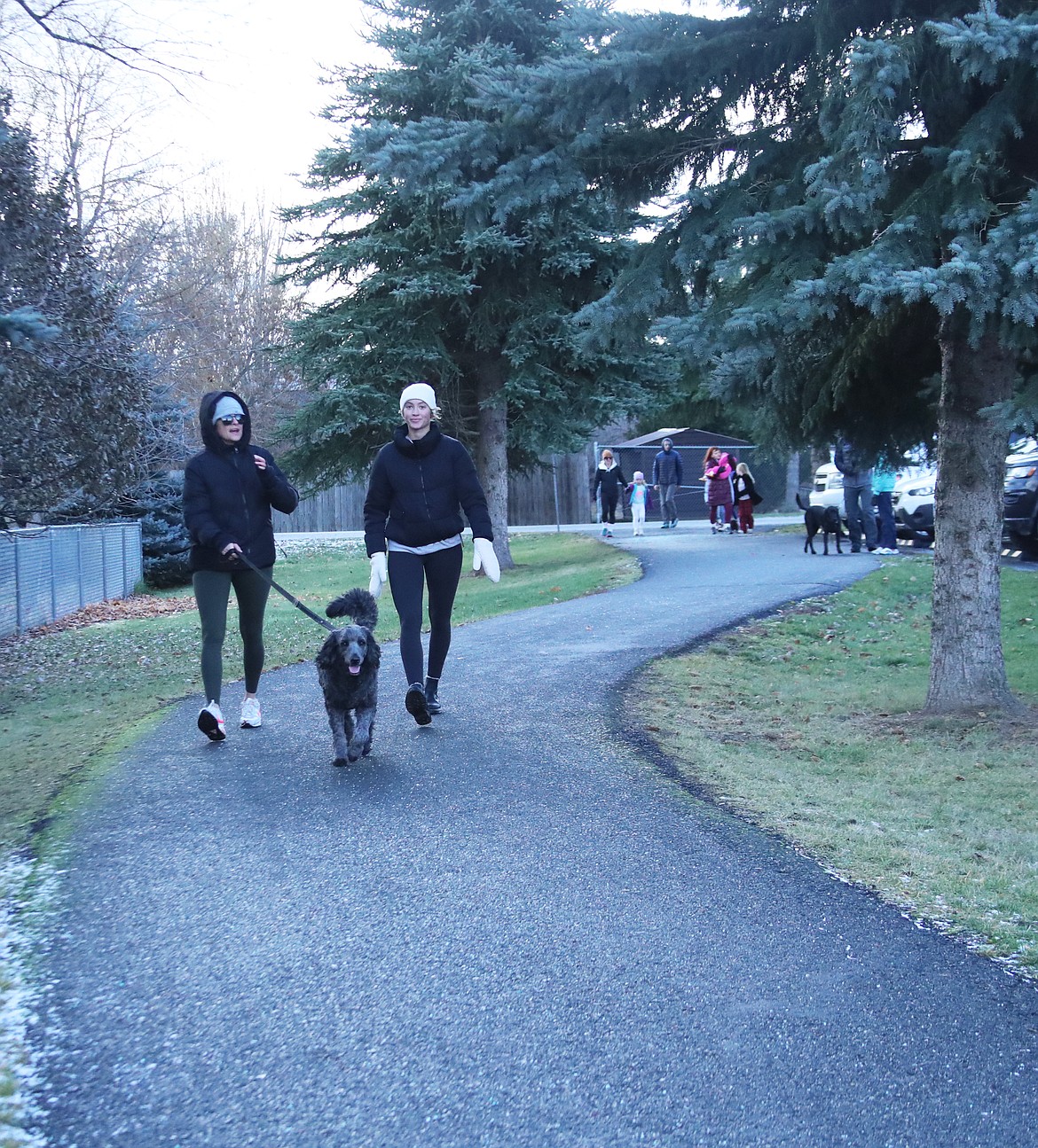 Turkey Trot participants walk along the pathway in Travers-Great Northern park complex.