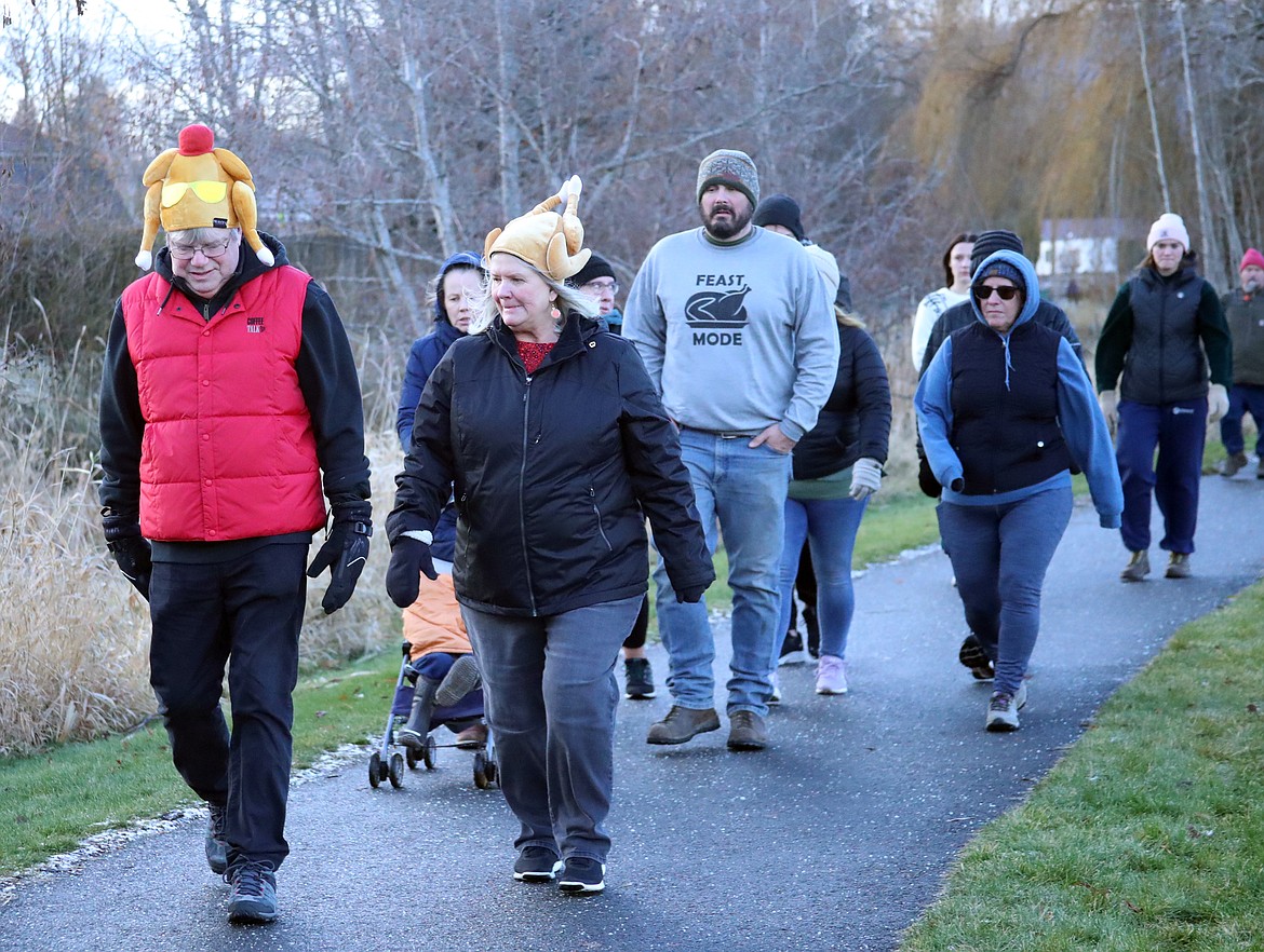 Turkey Trot participants walk along a path in the Great Northern-Travers park complex. The annual event benefits the Bonner Community Food Bank.