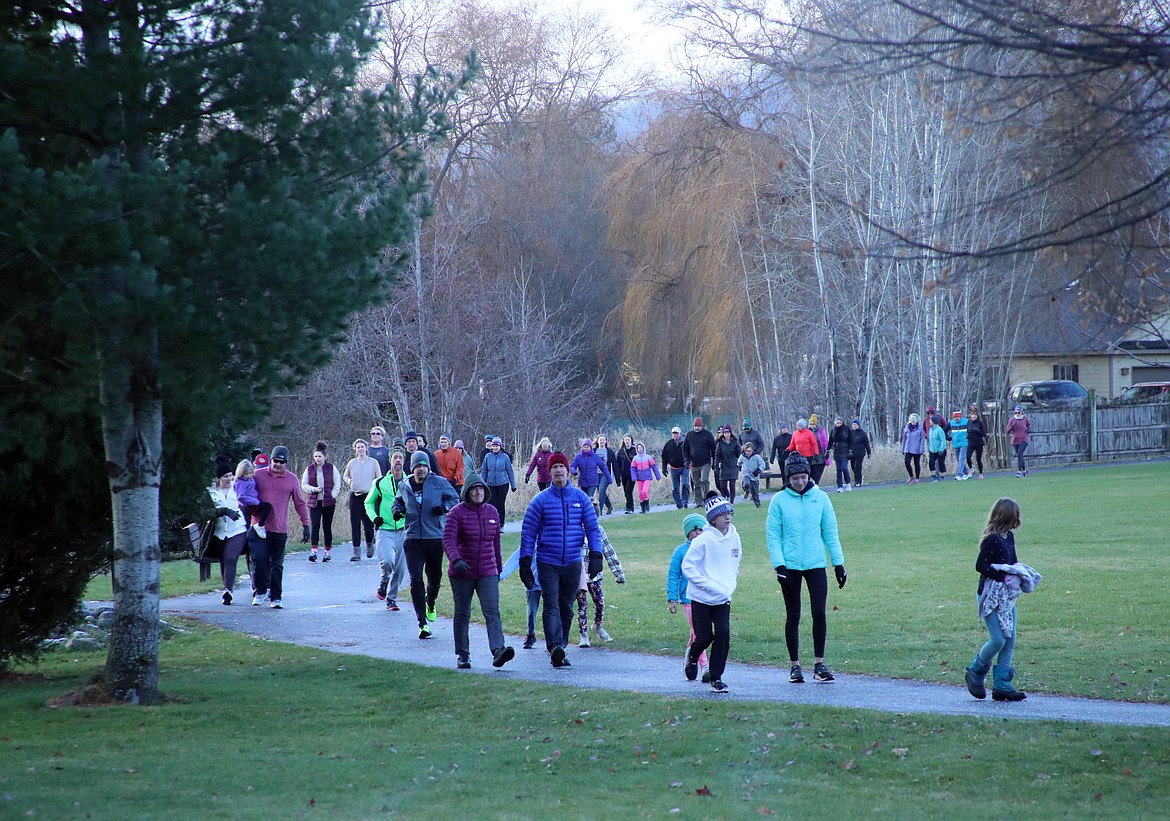 Turkey Trot participants walk along the pathway in the annual event, traditionally held on Thanksgiving Day as a benefit for the Bonner Community Food Bank.