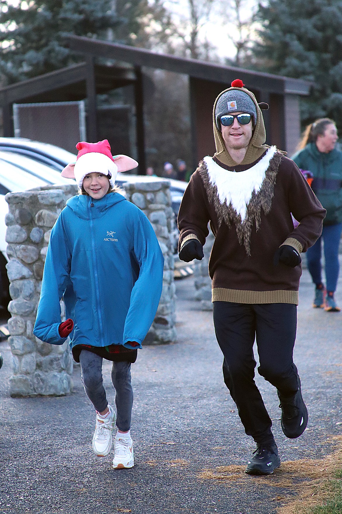 A pair of Turkey Trot participants get into the spirit as they kicked off their Thanksgiving Day by taking part in the benefit for the Bonner Community Food Bank.