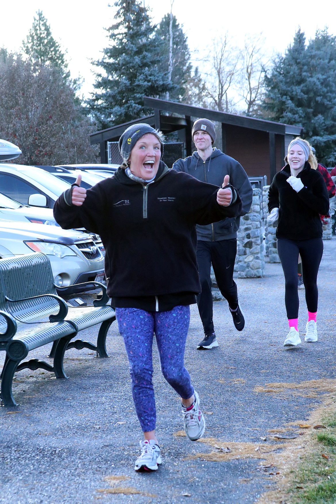 A runner gives the thumbs-up sign as she take part in the annual Turkey Trot fun run on Thursday.