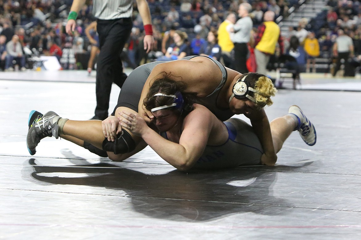 Ephrata graduate Jose Pelayo, top, was one of two Tigers to place at the 2A Mat Classic in Tacoma last season.