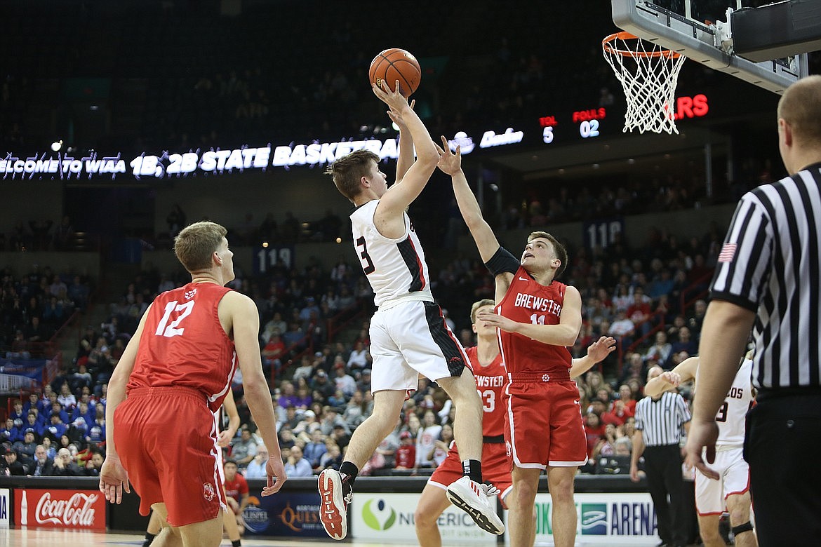 LRS junior Zach Klein (3) takes a shot close to the rim against Brewster in the 2B state semifinals last season.