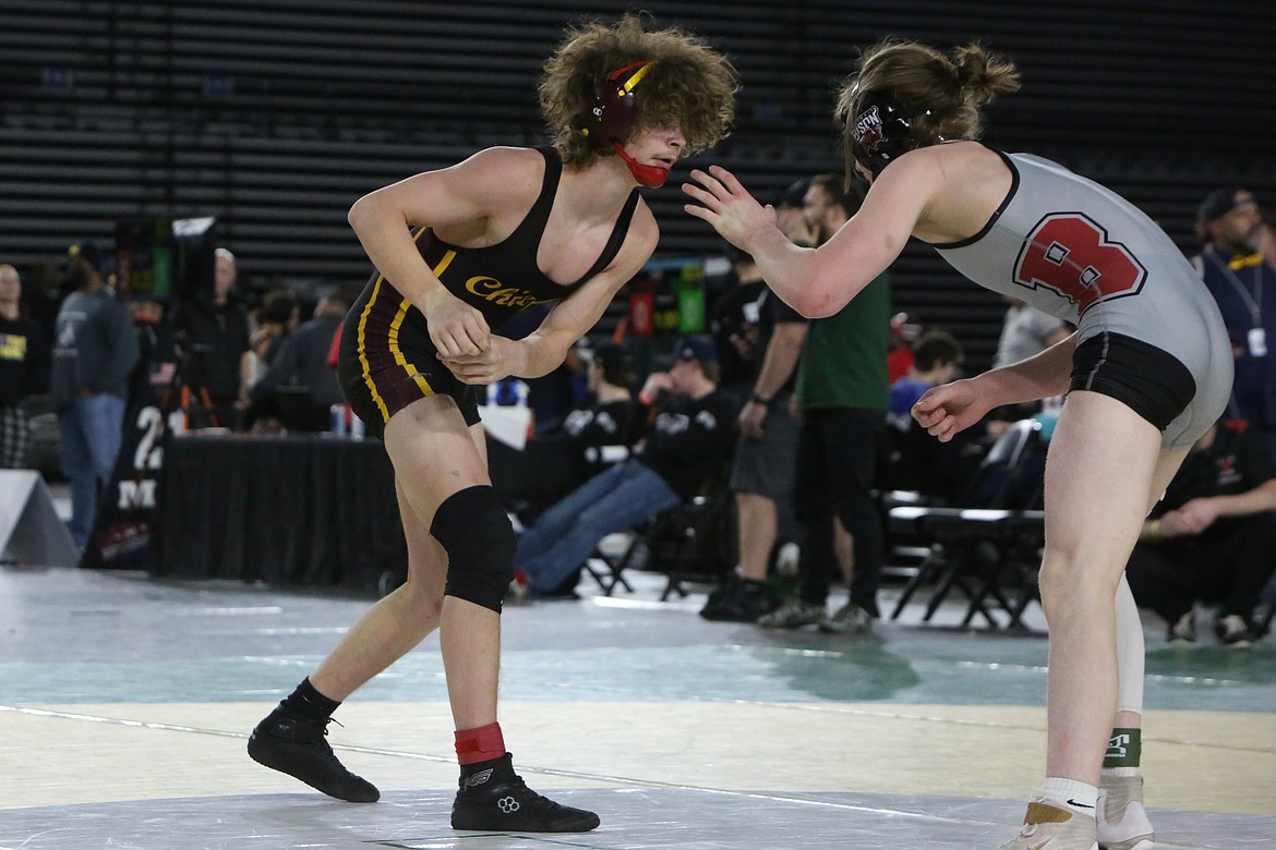 Moses Lake senior Dayton Regan, left, took fourth in the 4A 152-pound bracket at the Mat Classic.