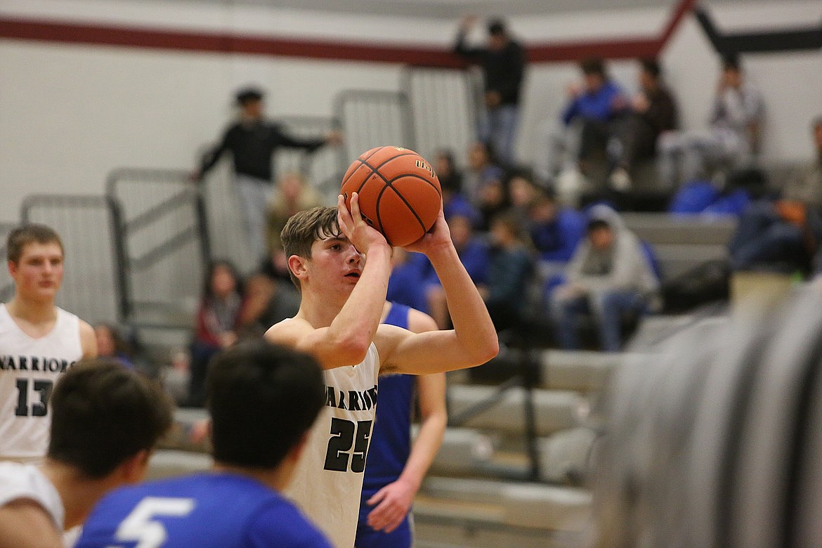 Almira/Coulee-Hartline freshman Max Grindy attempts a free throw in a game against Manson last season.