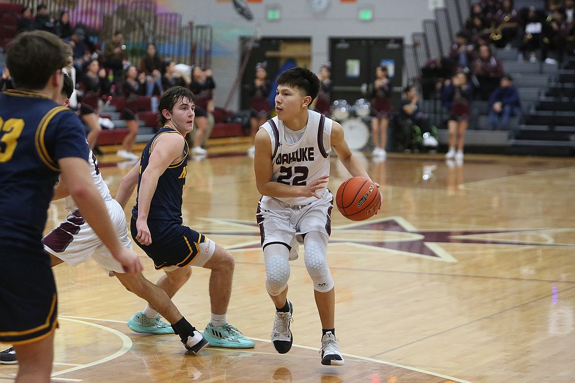 Wahluke junior River Buck (22) looks for an opportunity to take a shot against Naches Valley.