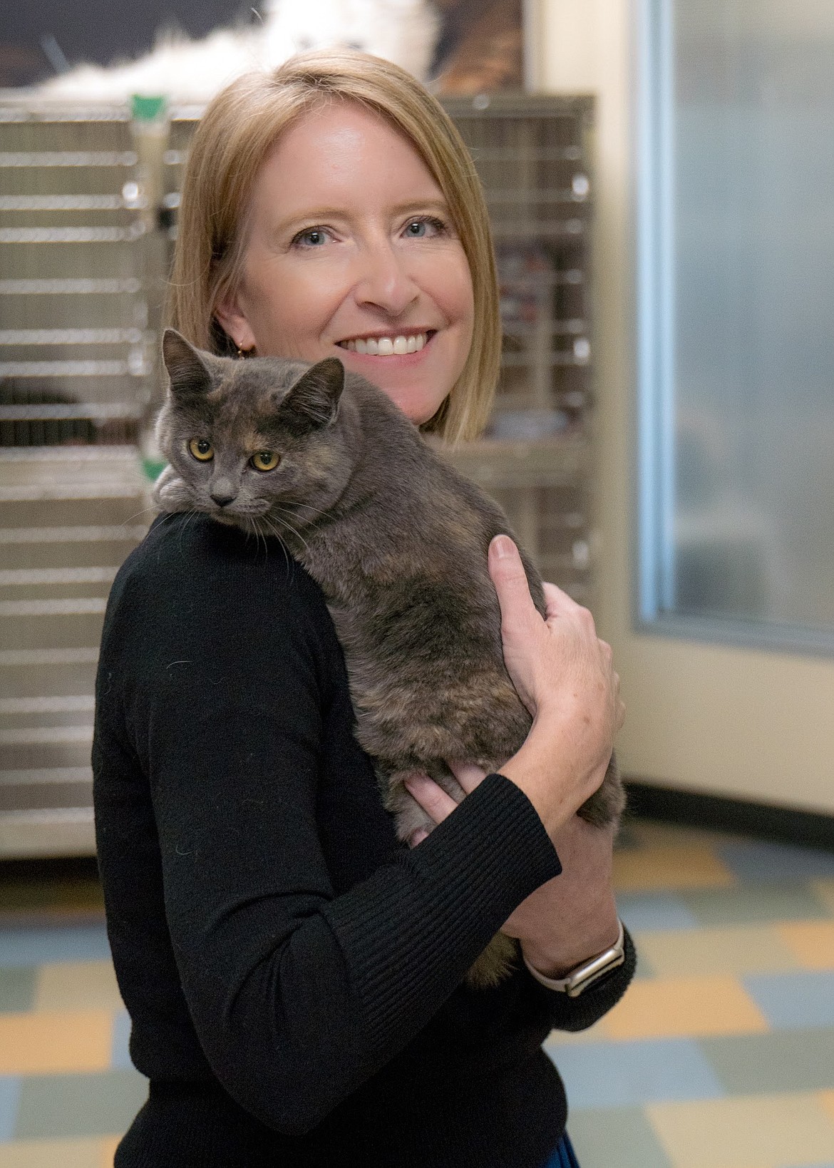 Mandy Evans, director of Better Together Animal Alliance, poses for a photo with Polka, one of the facility's guests looking for its forever home.