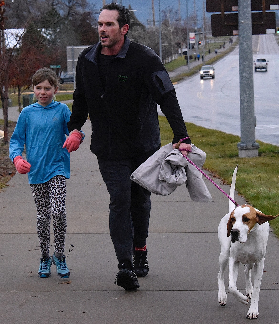 Families and dogs participated in the Turkey Trot on Thanksgiving morning beginning and ending at the Century 21 office on Hwy. 35. (Berl Tiskus/Leader)