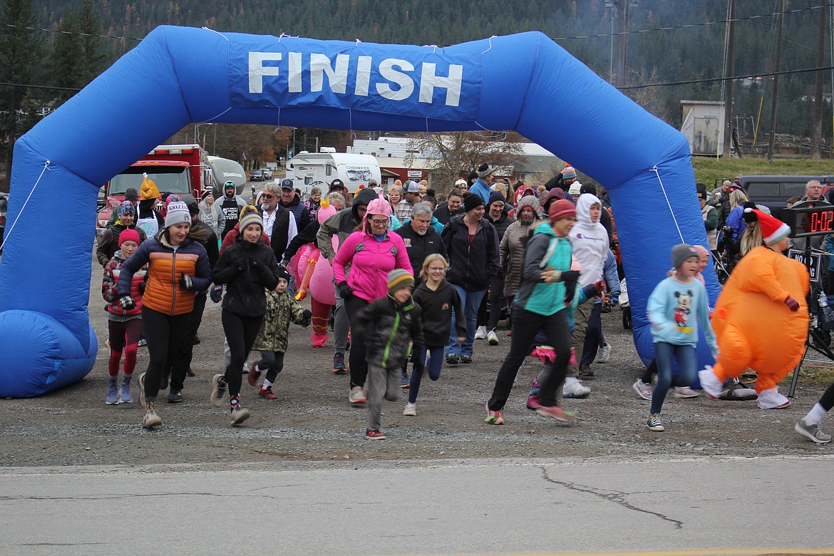 A few serious runners were at the front of the pack for the Turkey Trot, and right behind them were the walkers-and-talkers enjoying themselves Thanksgiving morning. This is the largest fundraiser the Mineral County Food Bank is involved in with the Rec Club doing the majority of the leg work knowing that the holidays are extra busy for families in need. (Monte Turner/Mineral Independent)