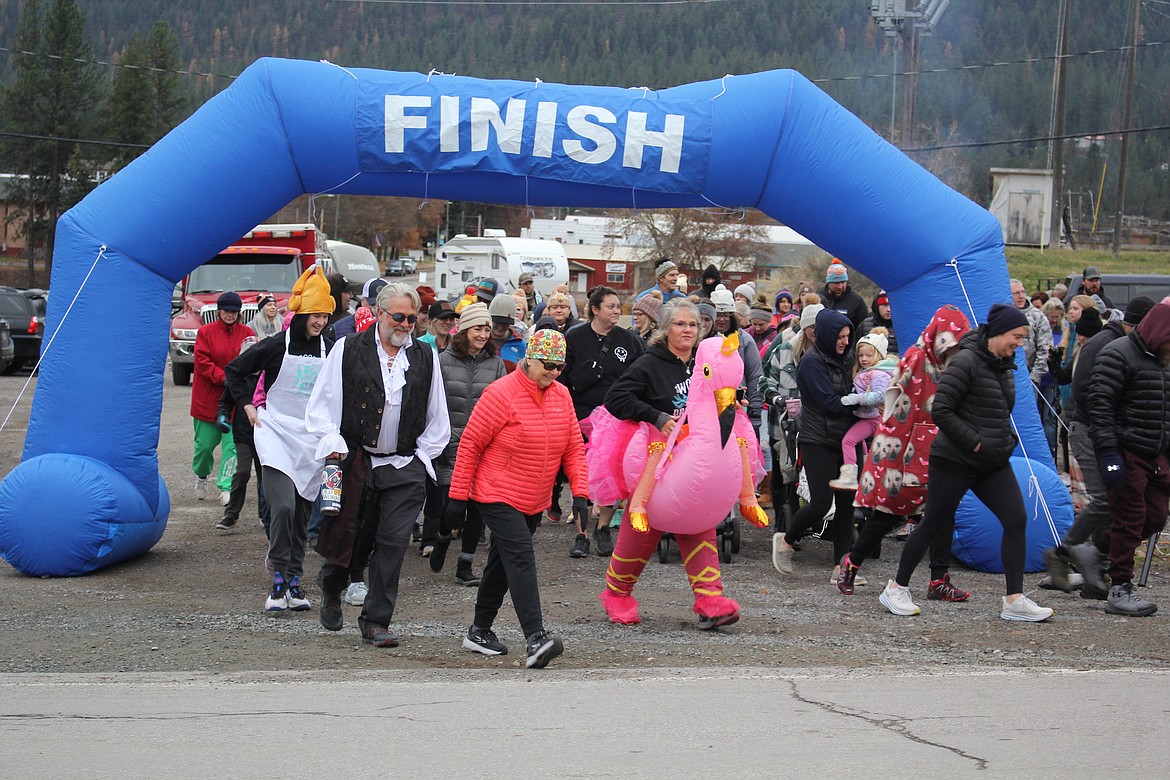 Dogs and costumes added extra fun to the Thanksgiving Day Turkey Trot 5K, sponsored by the Rec Club with the Mineral County Food Bank as the recipient of all donations. (Monte Turner/Mineral Independent)