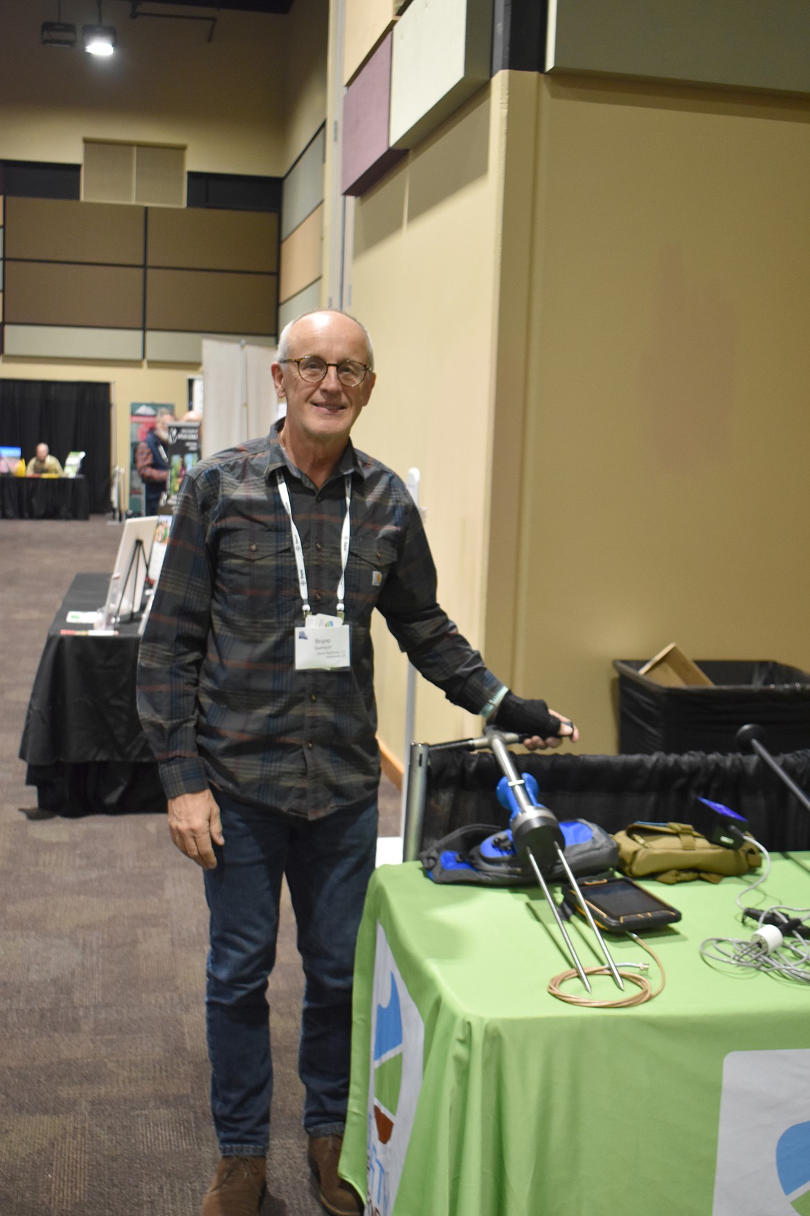 Bruno Quanquin, owner of Earth Platforms, shows a portable soil monitor designed to track moisture for irrigators.