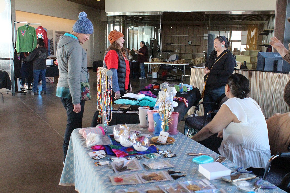 Shoppers check out the wares at the bazaar at the Wanapum Heritage Center near Mattawa.