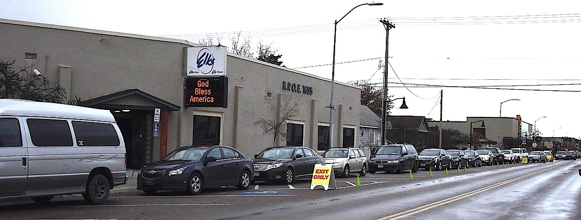 Vehicles were lined up clear past the Showboat Stadium 6 waiting for their turn to pick up Thanksgiving dinner for the family. (Berl Tiskus/Leader)