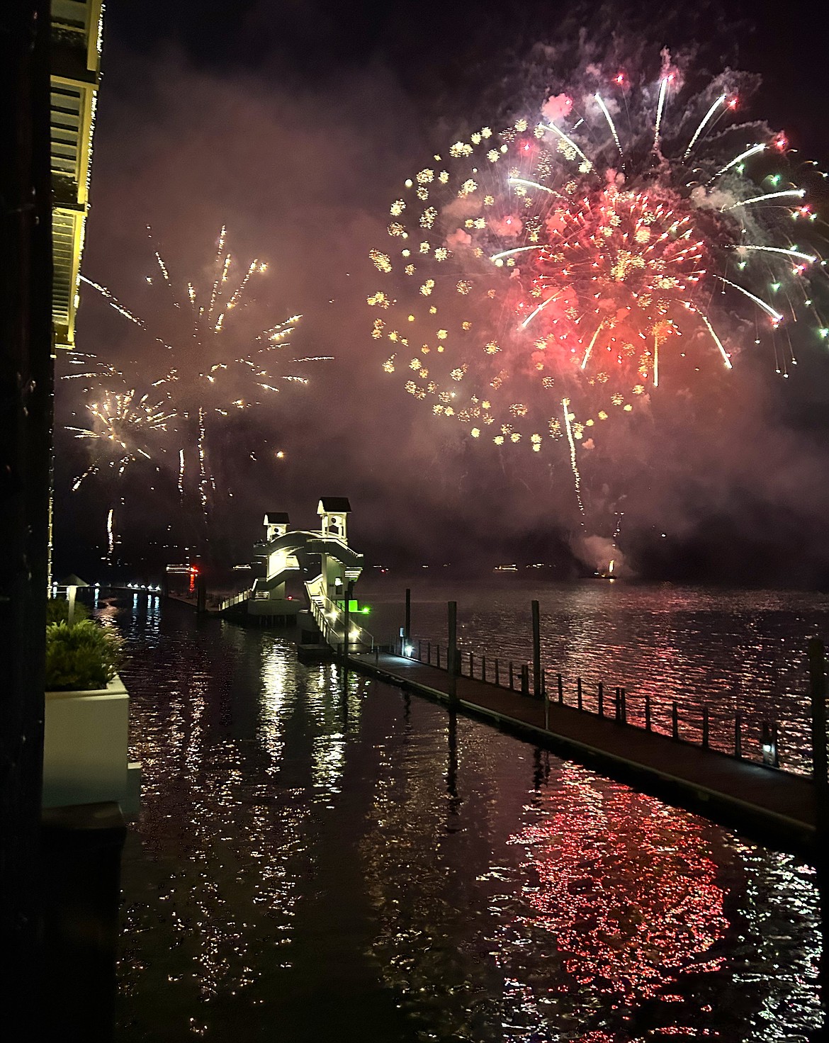Fireworks courtesy of the Hagadone family explode over Lake Coeur d'Alene following the parade.