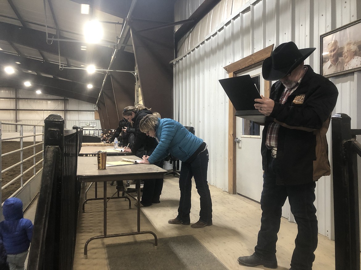 Miss Moses Lake Roundup judges make notes as Alexis Shoults shows her skills in horsemanship and other areas during this year’s pageant.