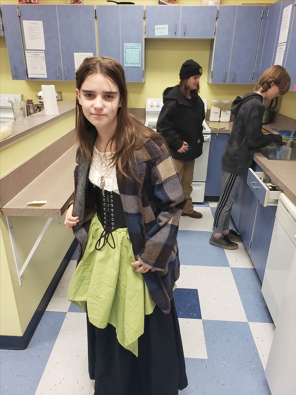 Lily Thornton bakes breadsticks with her group members Bella Leone, center, and Syles Brown for the Timberlake Junior School Renaissance Faire Wednesday.