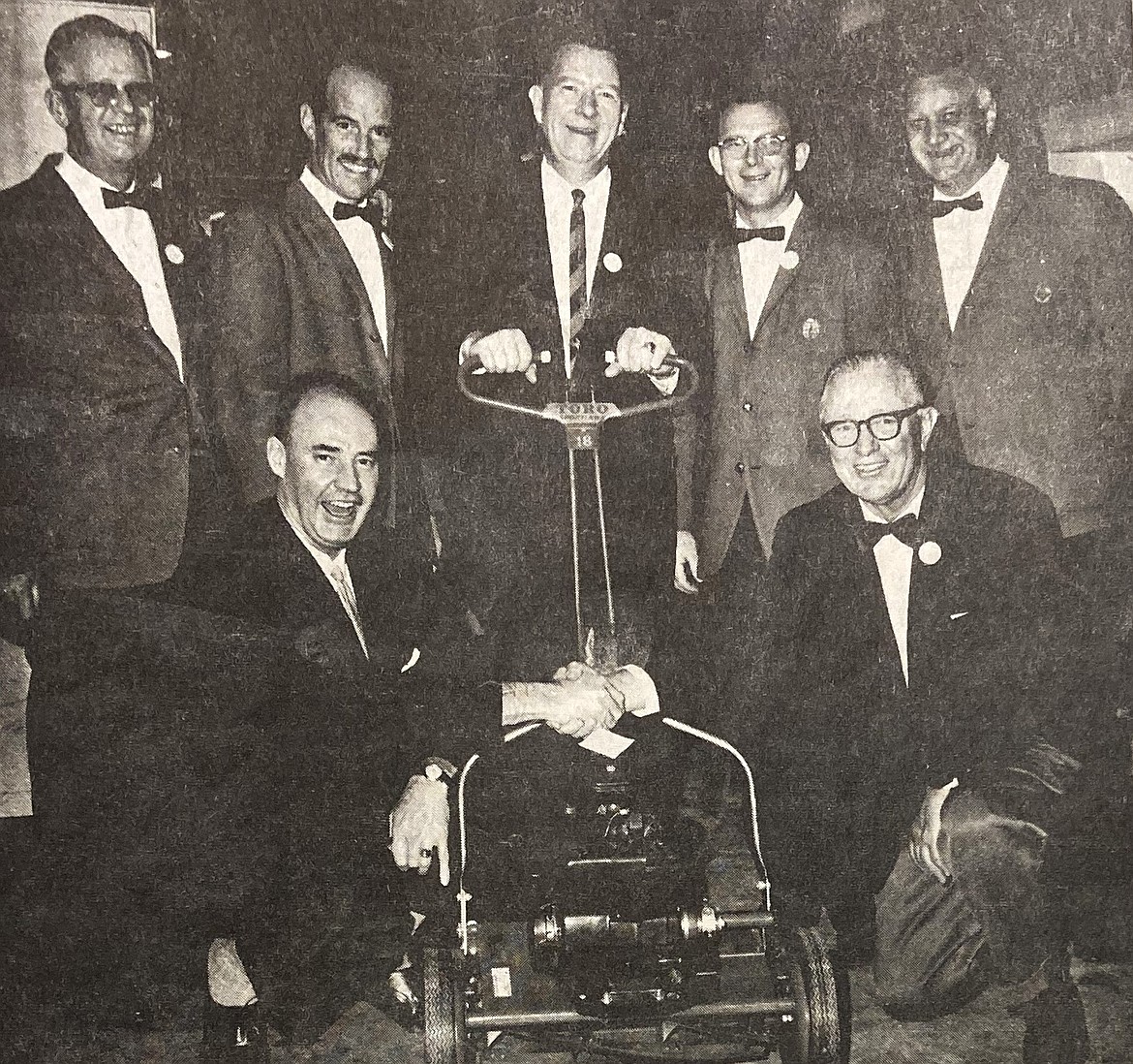 Members of the Athletic Round Table were key to the success of the hydroplane races (1958-68). They sponsored a fundraiser for the races Nov. 18, 1963. Commodore Carter Crimp, front left, is shown congratulating Clive Roberts of Hayden Lake, who won a power mower, one of the evening’s prizes. Knights of the Round Table in the back are, from left, Art Peterson, Bob Nobis, Ron MacDonald, Glenn Durand and Vernon James.