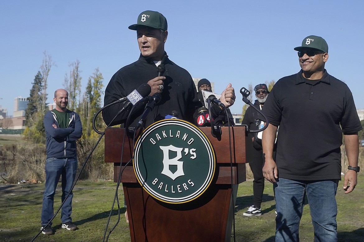 Oakland Ballers Executive Vice President of baseball Operations Don Wakamatsu, middle, speaks next to manager Micah Franklin, right, during a news conference at Laney College in Oakland, Calif., Tuesday, Nov. 28, 2023. A new independent league baseball team called the Oakland Ballers is set to begin play next spring and embrace the loyal A's fans who are heartbroken about their club's planned departure to Las Vegas. (AP Photo/Jeff Chiu)