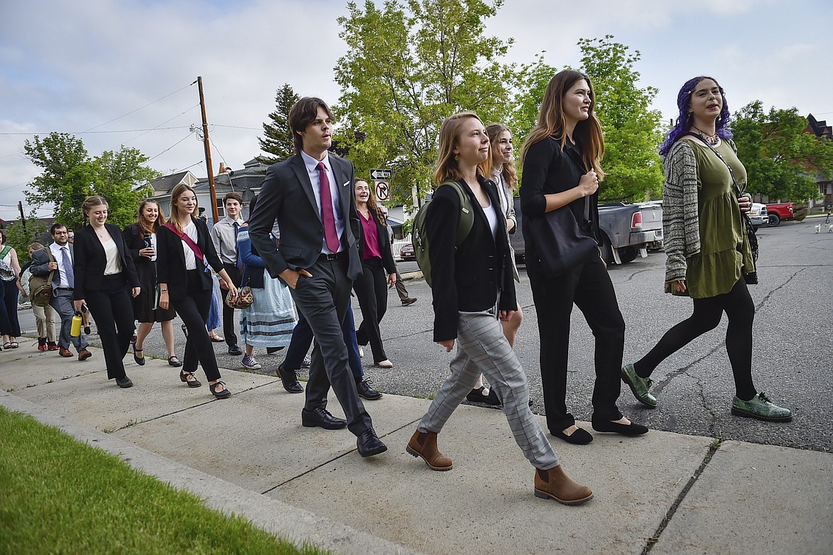 Young plaintiffs in a climate lawsuit challenging Montana's government for not doing enough to combat climate change are seen outside the Lewis and Clark County Courthouse, June 12, 2023, in Helena, Mont. The youth, who won their lawsuit saying the state was not doing enough to prevent climate change, are supporting environmental groups in their effort to block a natural gas-fired power plant on the banks of the Yellowstone River in south-central Montana. The youth filed an amicus brief in the case before the Montana Supreme Court on Tuesday, Nov. 28. (Thom Bridge/Independent Record via AP, File)