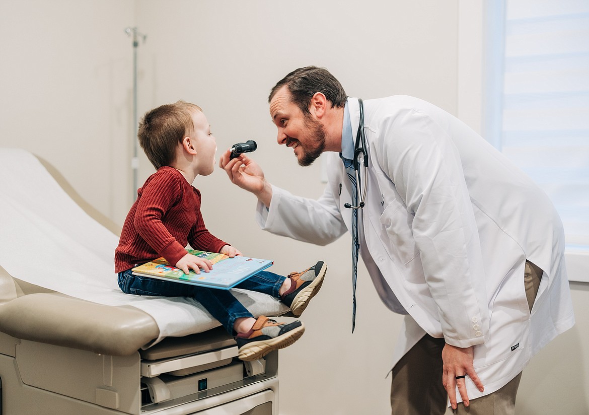 (right) Dr. Gorman treats a young patient.