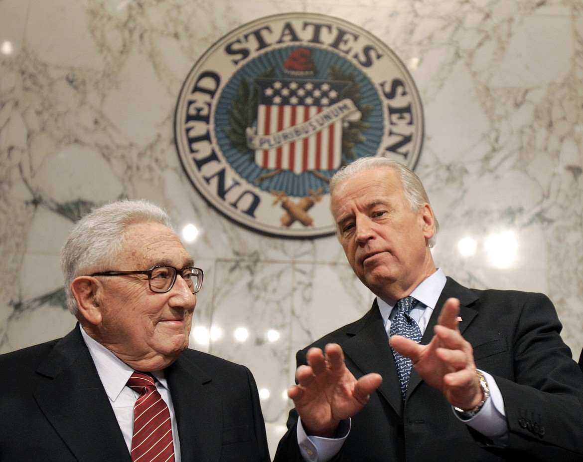 Former Secretary of State Henry Kissinger, left, talks with Senate Foreign Relations Committee Chairman Sen. Joseph Biden, D-Del., on Capitol Hill in Washington, Jan. 31, 2007, prior to Kissinger testifying before the committee about Iraq. Kissinger, the diplomat with the thick glasses and gravelly voice who dominated foreign policy as the United States extricated itself from Vietnam and broke down barriers with China, died Wednesday, Nov. 29, 2023. He was 100. (AP Photo/Susan Walsh, File)