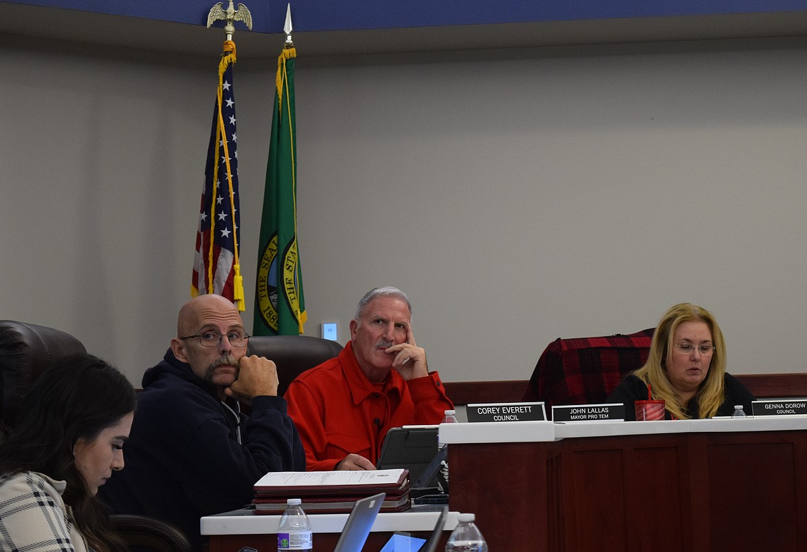 Othello City Council members Corey Everett, second to left, John Lallas, middle, and Genna Dorow, right, listen to city staff during Monday’s regular council meeting at Othello City Hall.