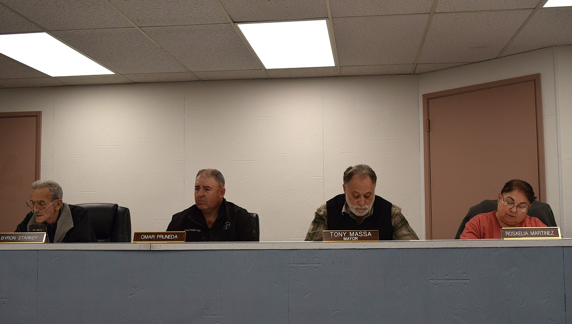 Warden City Council members Byron Starkey, Omar Pruneda, Mayor Tony Massa and council member and Mayor-elect Rosaelia Martinez listen to staff reports during Tuesday’s regular meeting, during which the council approved water and sewer rate increases and the 2024 final budget.