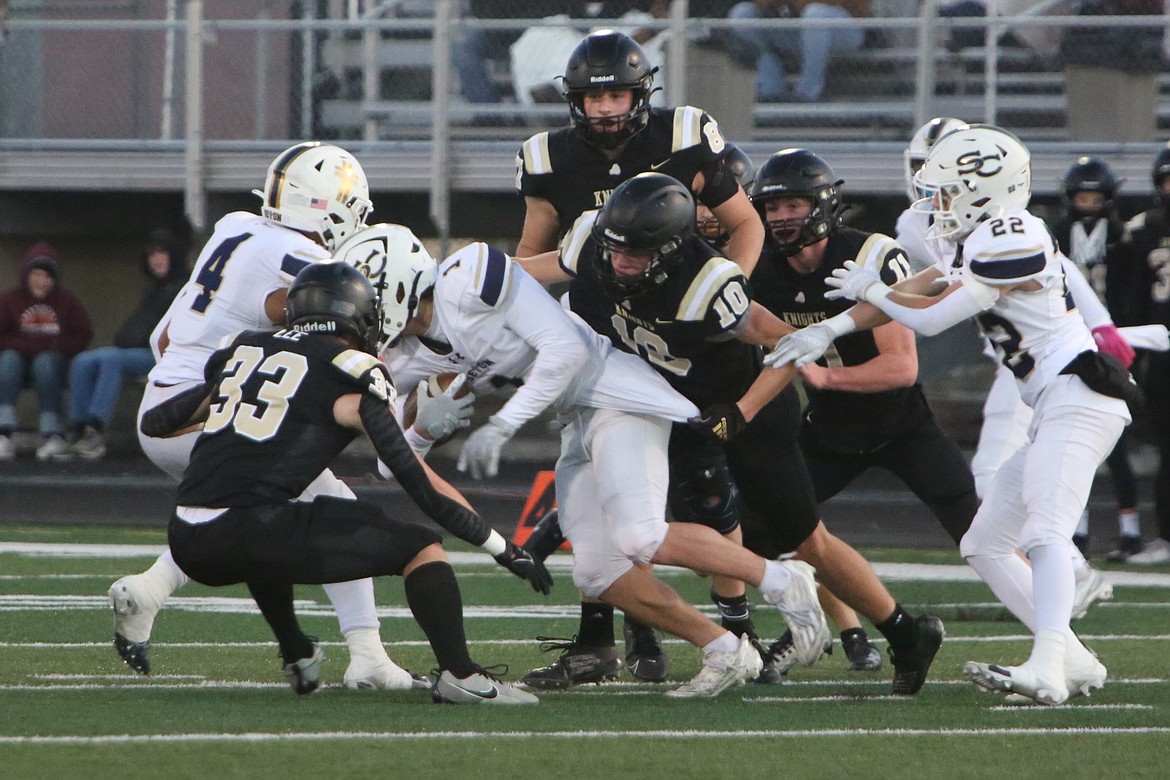 Members of the Royal defense rally to make a tackle against Seton Catholic on Saturday. The Royal defense has only given up seven touchdowns this season.